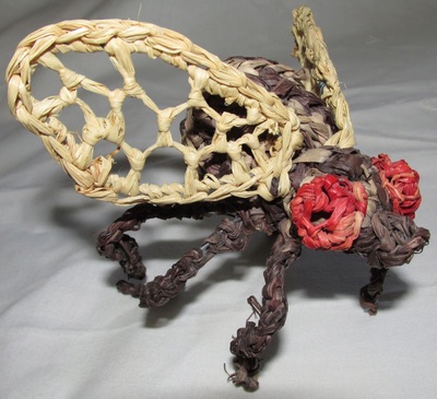 Fly ornament, crocheted raffia