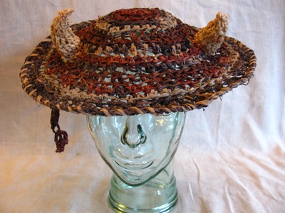 Buffalo Horns Hat, crocheted raffia by C. Buffalo Larkin