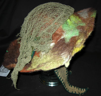 Felt Camouflage Hat with Netting (side view), wet felting and needle felting by C. Buffalo Larkin