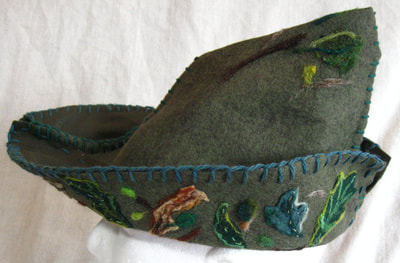 Robin Hood Hat (green felt with needle felt ornamentation), made by C. Buffalo Larkin